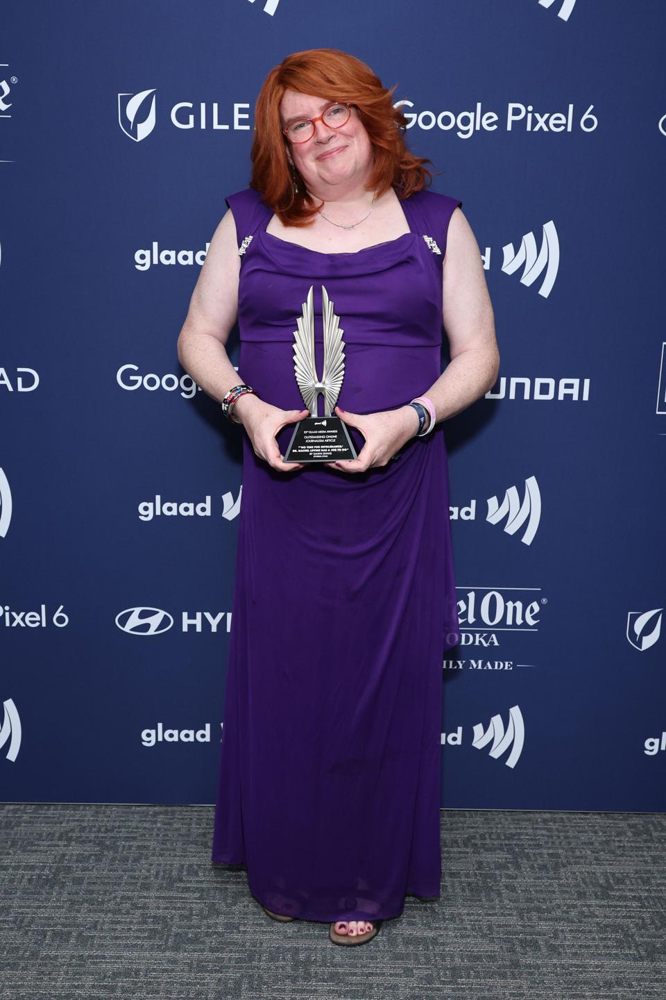 Dawn Ennis displays her GLAAD Media Award